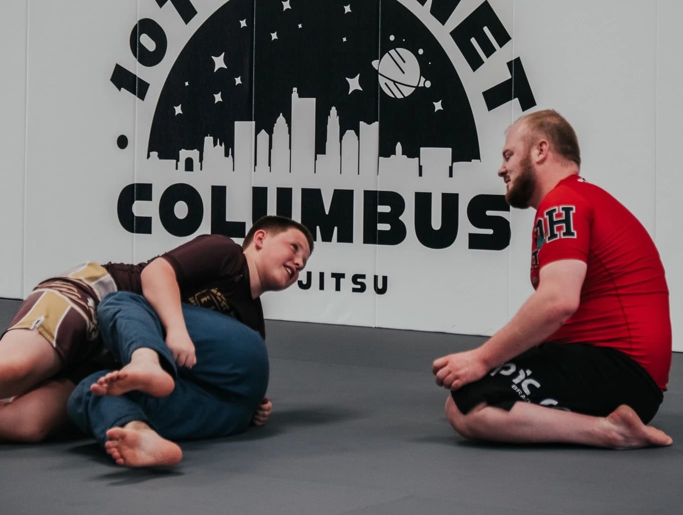 Coach Zack Holycross teaching kids no-gi Jiu-Jitsu at 10th Planet Columbus